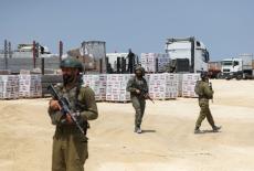 Israeli soldiers secure humanitarian aid near Erez Crossing in northern Gaza
