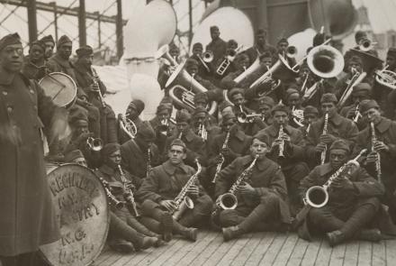 A black and white photo of a large orchestra consisting entirely of Black musicians.