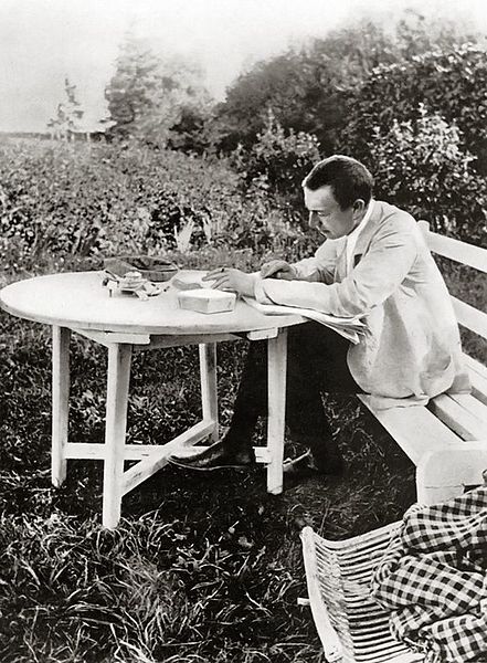 Rachmaninoff sitting outside and working on his music