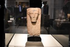 Carved stone head artifact