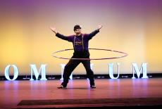 Omnium performer hula-hooping onstage