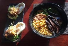 Ramen bowl and chashu buns at Sakuramen