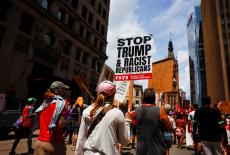 Demonstrators and members of the The Coalition to March on the RNC hold a rally, on the first day of the Republican Nation...