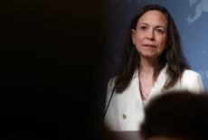 Nobel Peace Prize laureate and Venezuelan opposition leader Maria Corina Machado listens during a press conference in Oslo