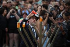 People pay respects at Bondi Pavilion to victims of a shooting during a Jewish holiday celebration at Bondi Beach, in Sydney