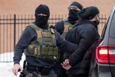 Members of U.S. Immigration and Customs Enforcement (ICE) conduct raids in Minneapolis