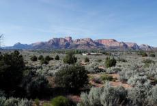 Red rock cliffs rise above Colorado City, Arizona and Hildale, Utah where the FLDS Church's Prophet leaders Warren Jeffs l...