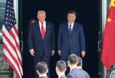 FILE PHOTO: U.S. President Donald Trump meets with Chinese President Xi Jinping on the sidelines of the APEC summit, in Busan