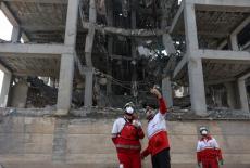 Red Crescent rescue team at the site of a building that was damaged by a strike, in Tehran