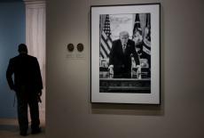 People view the portrait of U.S. President Donald Trump at the Smithsonian National Portrait Gallery in Washington