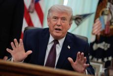 U.S. President Trump signs an executive order in the Oval Office of the White House