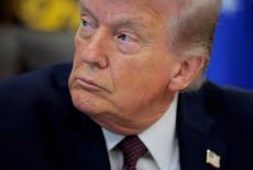 FILE PHOTO: U.S. President Trump signs an executive order in the Oval Office of the White House