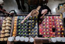 FILE PHOTO: People shop for groceries at a store in New York City