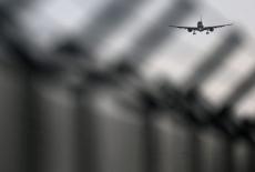 FILE PHOTO: Aircraft prepares to land at Brussels International Airport, in Zaventem