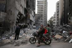 People visit the site of Israeli strikes, following the ceasefire, in Beirut