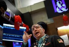 Traders work on the floor of the NYSE in New York