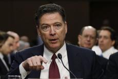 Former FBI Director James Comey testifies before a Senate Intelligence Committee hearing in Washington