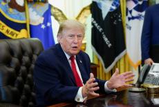 FILE PHOTO: U.S. President Donald Trump signs an executive order in the Oval Office at the White House