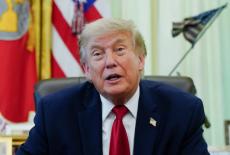 U.S. President Donald Trump signs an executive order in the Oval Office at the White House