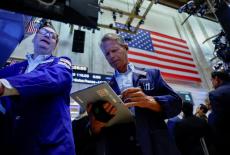 Traders work on the floor at the New York Stock Exchange (NYSE) in New York City