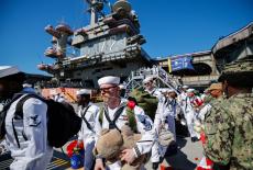 The US Navy Nimitz-class aircraft carrier USS Abraham Lincoln returns home following an extended deployment in the Middle ...