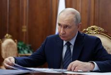 Russian President Vladimir Putin meets with Sports Minister Mikhail Degtyarev in Moscow