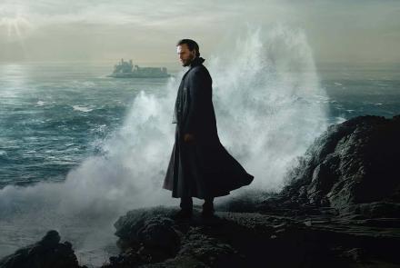 Monte Cristo standing on jagged rocks with waves crashing