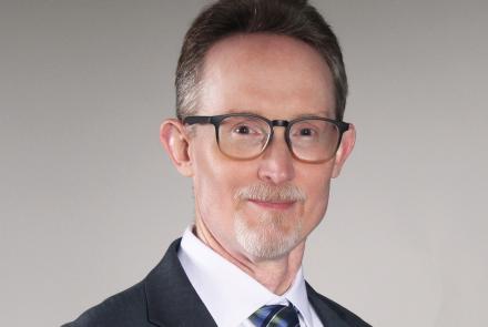 Man in suit with glasses