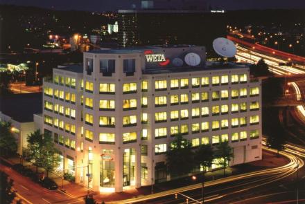 External photo of the WETA building at night. 