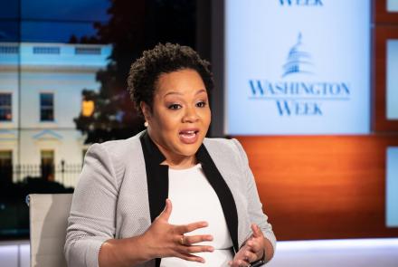 Yamiche Alcindor gestures while seated at the table on the Washington Week set.