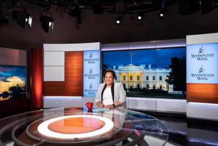An angled shot of Yamiche Alcindor sitting at the table on the Washington Week set