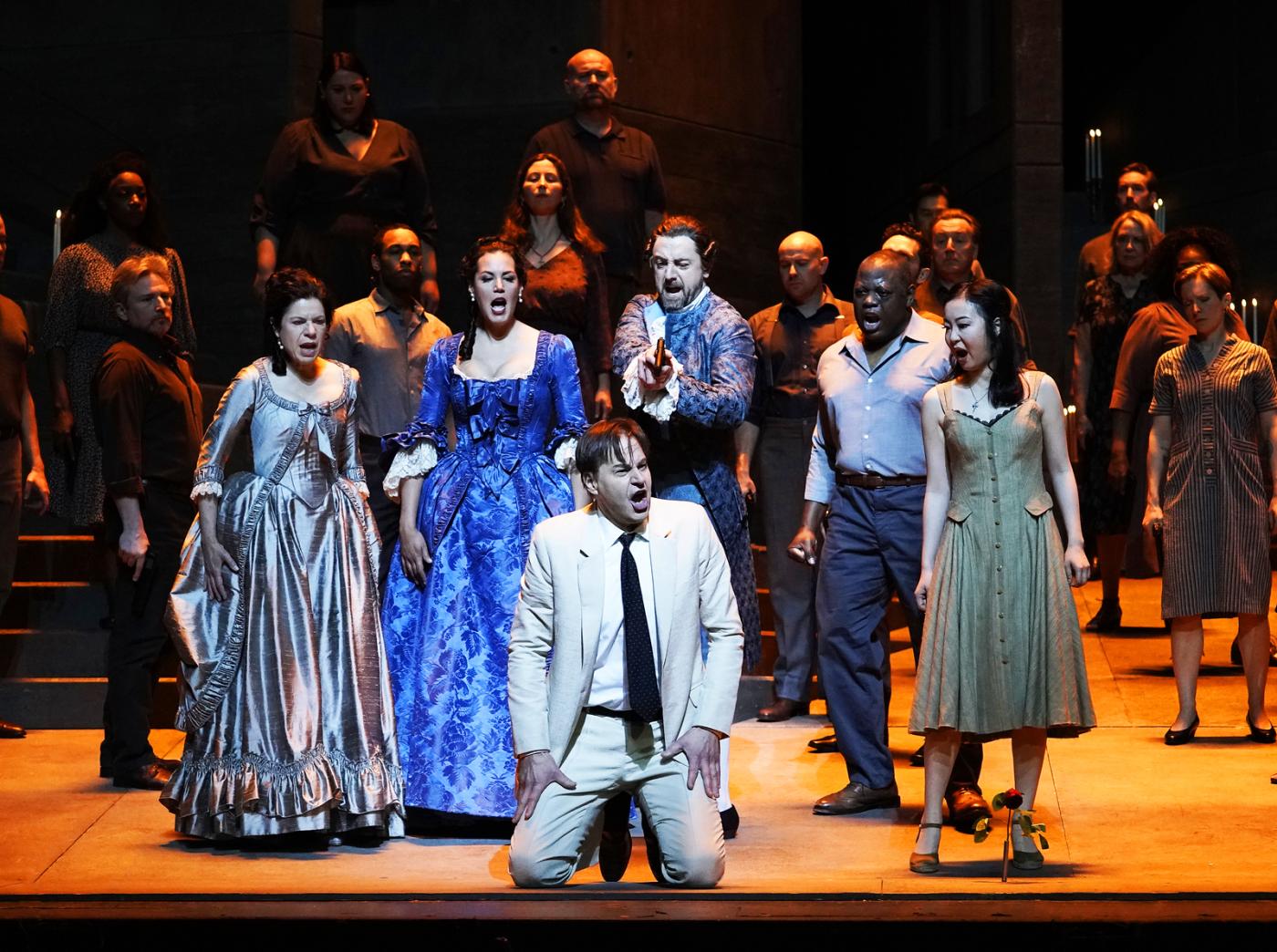 A scene from Mozart's "Don Giovanni" with Ana María Martínez as Donna Elvira, Federica Lombardi as Donna Anna, Peter Mattei (kneeling) as Don Giovanni, Ben Bliss as Don Ottavio, Alfred Walker as Masetto, and Ying Fang as Zerlina. Photo: Karen Almond / Met Opera